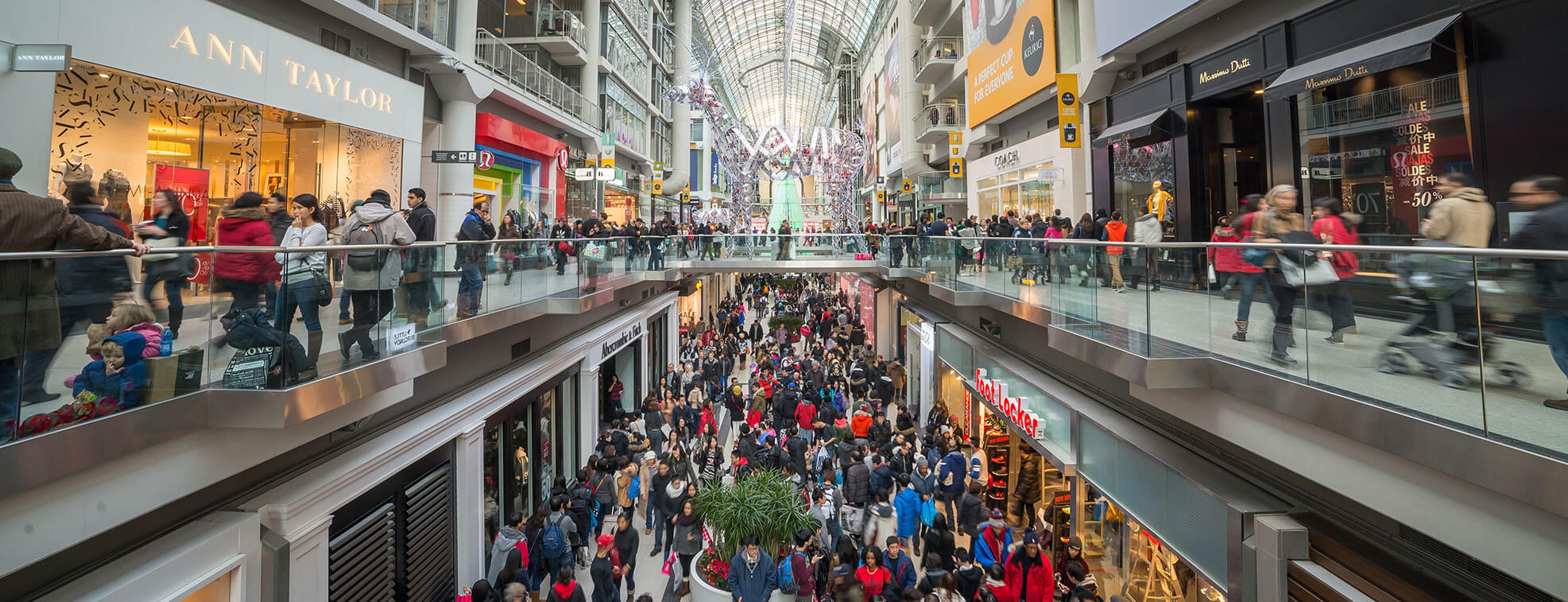 Crowd of people at a mall during a sale season