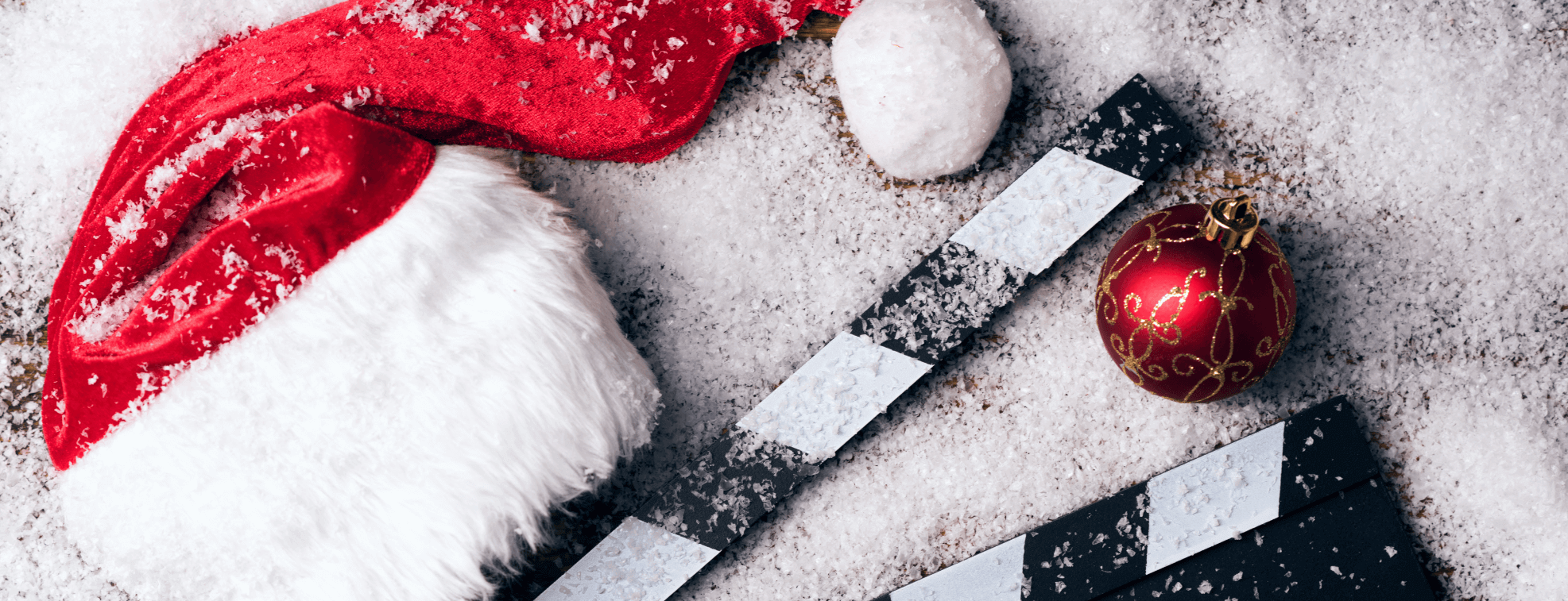 Films and Santa hat on the snow